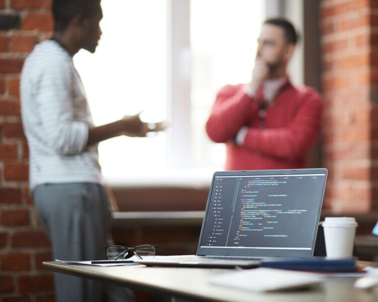 two business people standing and talking.