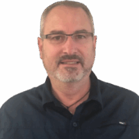 Jeff headshot Headshot of a man with grey hair, glasses and a black shirt